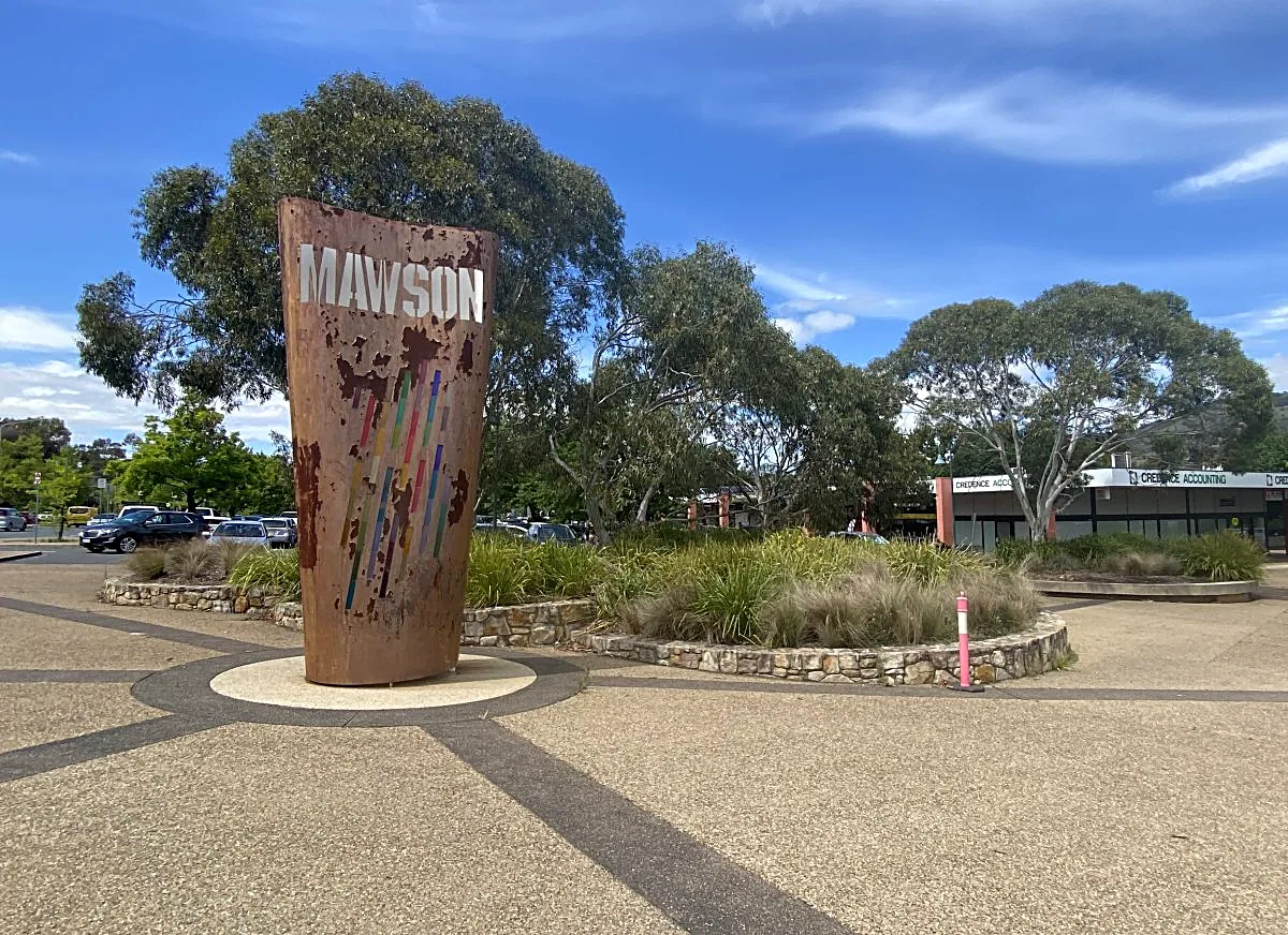 Mawson shops sign — a tall rusted steel sculpture at the Southlands shopping precinct