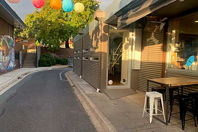 Farrer village shops — local cafe with colourful paper lanterns over the street