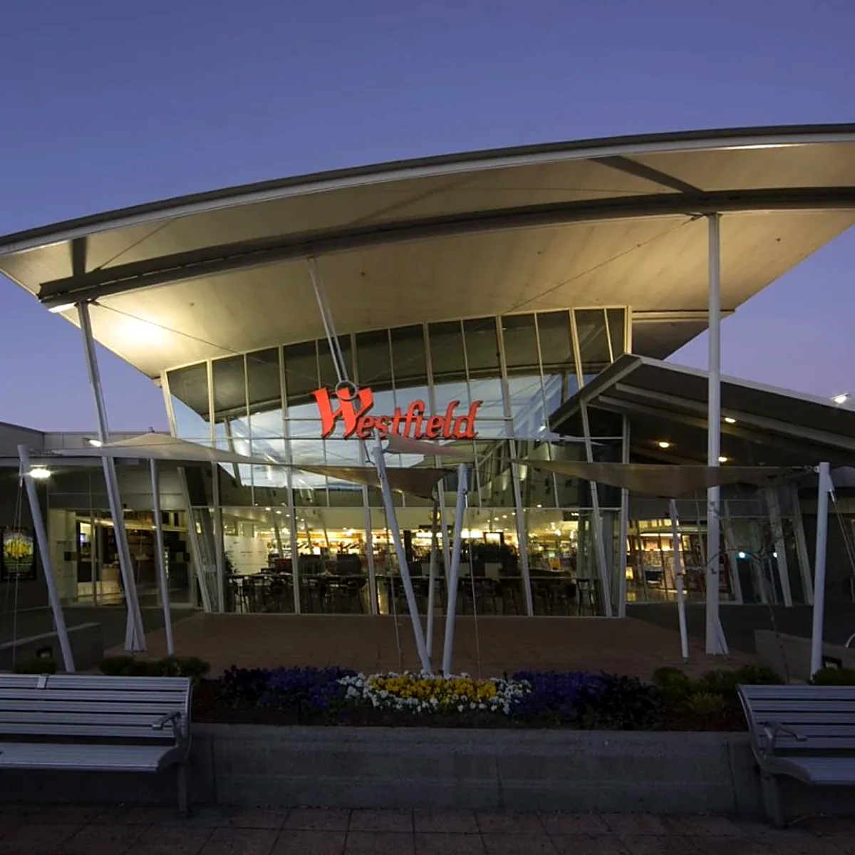 Westfield Woden shopping centre entrance at dusk with its distinctive canopy