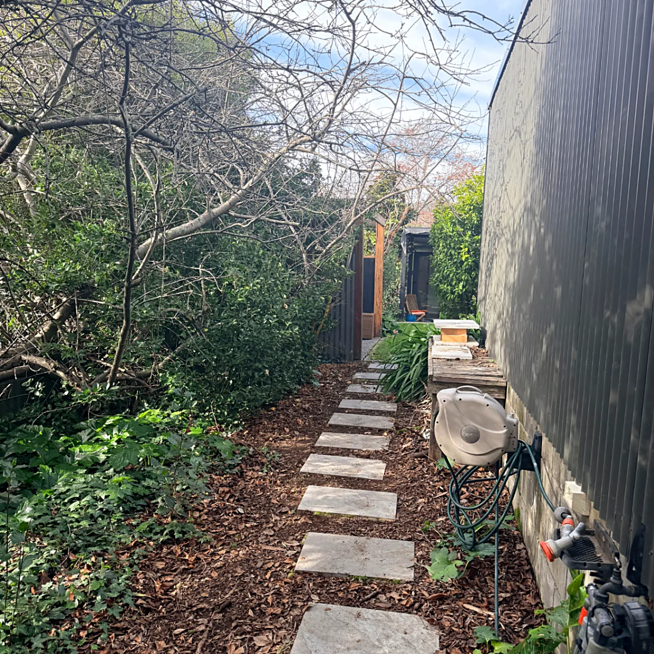 Stepping stone path leading around to the studio courtyard